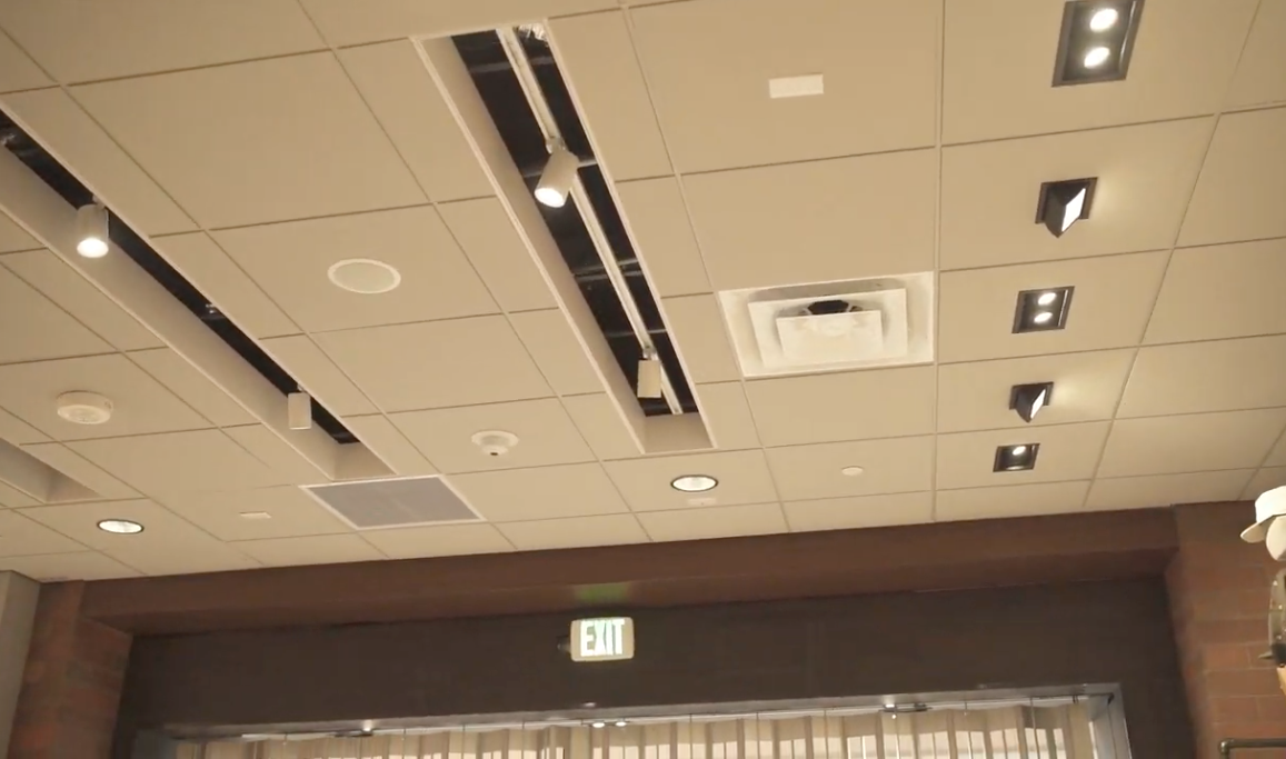 Suspended acoustic ceiling tile installation with integrated lighting