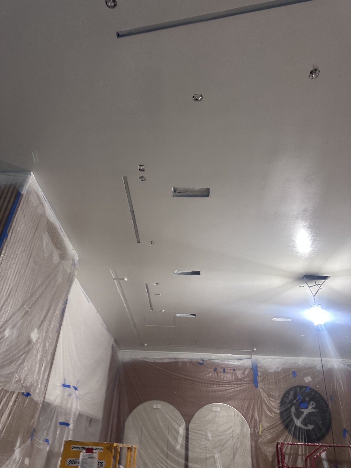 Protected commercial interior with smooth finished ceiling